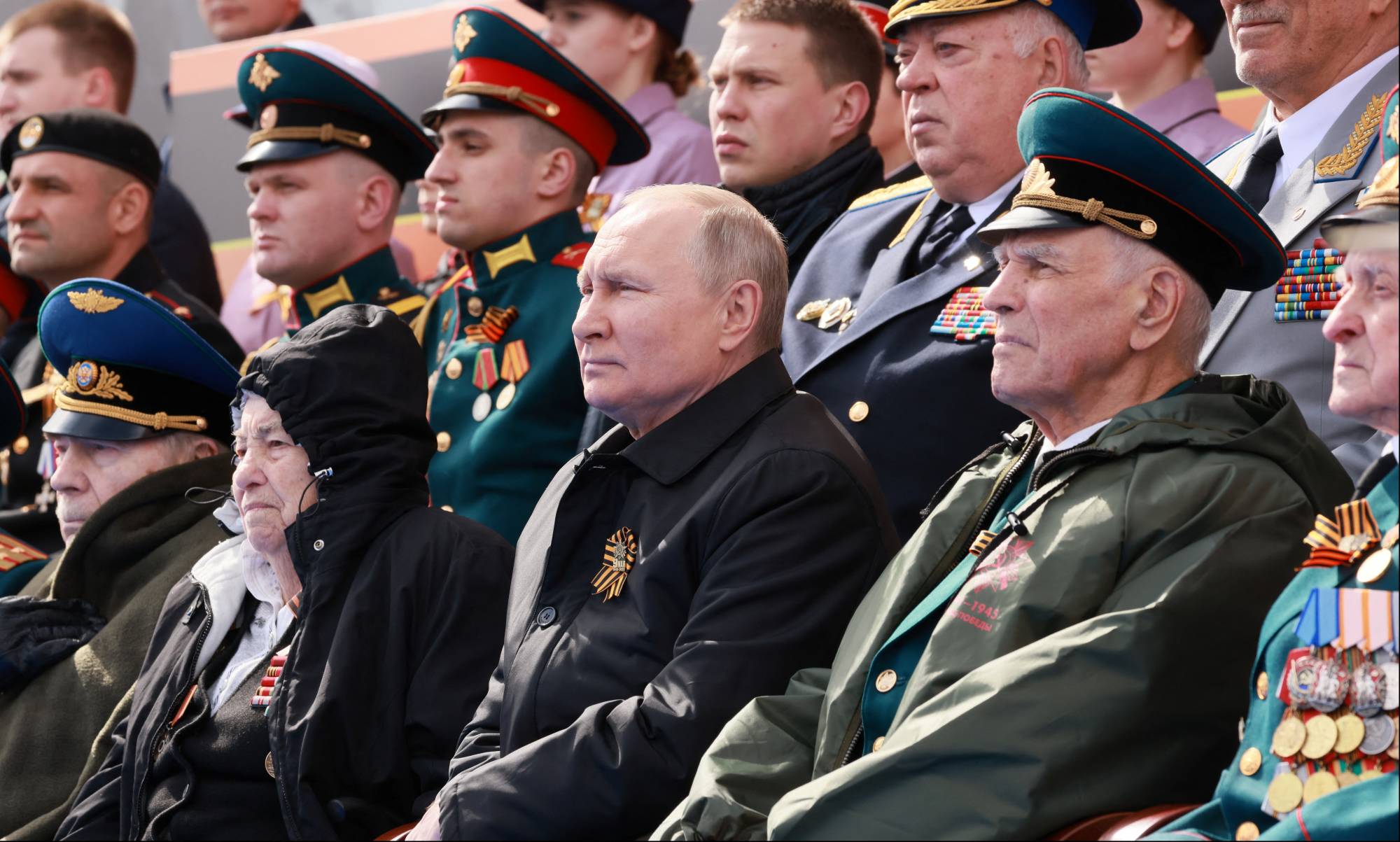 Russian President Vladimir Putin watches a military parade on Victory Day in Red Square in central Moscow on Monday. | SPUTNIK / POOL / VIA REUTERS 