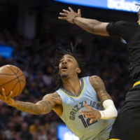 Grizzlies guard Ja Morant attempts a shot against the Warriors during Game 3 of their Western Conference semifinal series in San Francisco on Saturday. | USA TODAY / VIA REUTERS