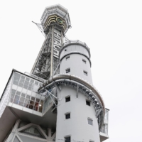 A 60-meter slide at Osaka\'s landmark Tsutenkaku Tower opened on Monday. | KYODO
