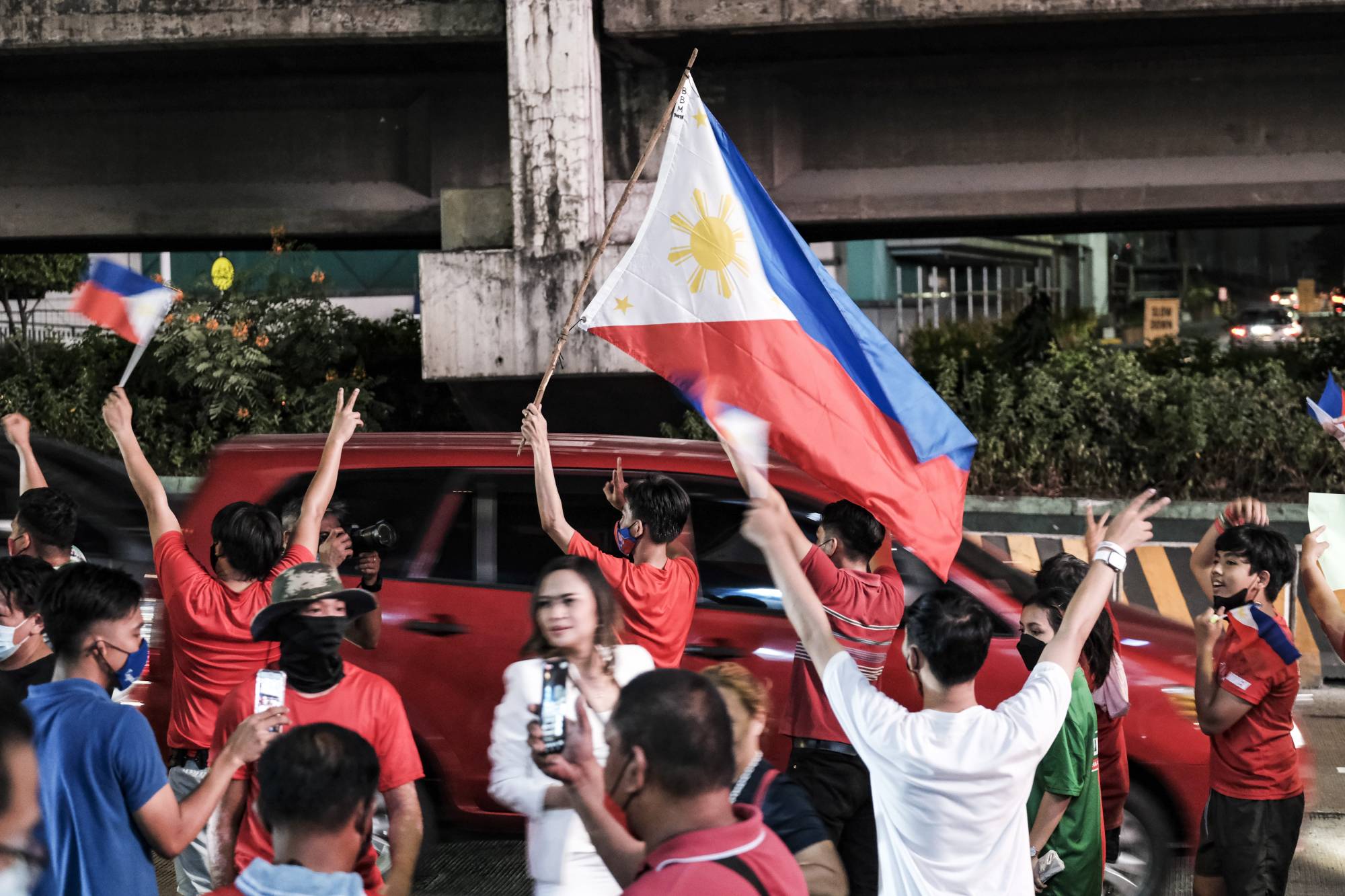 Supporters of Ferdinand Marcos Jr. outside his campaign headquarters in Manila on Monday. | Bloomberg