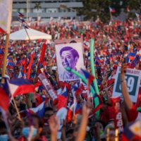 Supporters of Ferdinand Marcos Jr. cheer on Saturday during the last campaign rally ahead of the election, in Paranaque City, suburban Manila. | AFP-JIJI