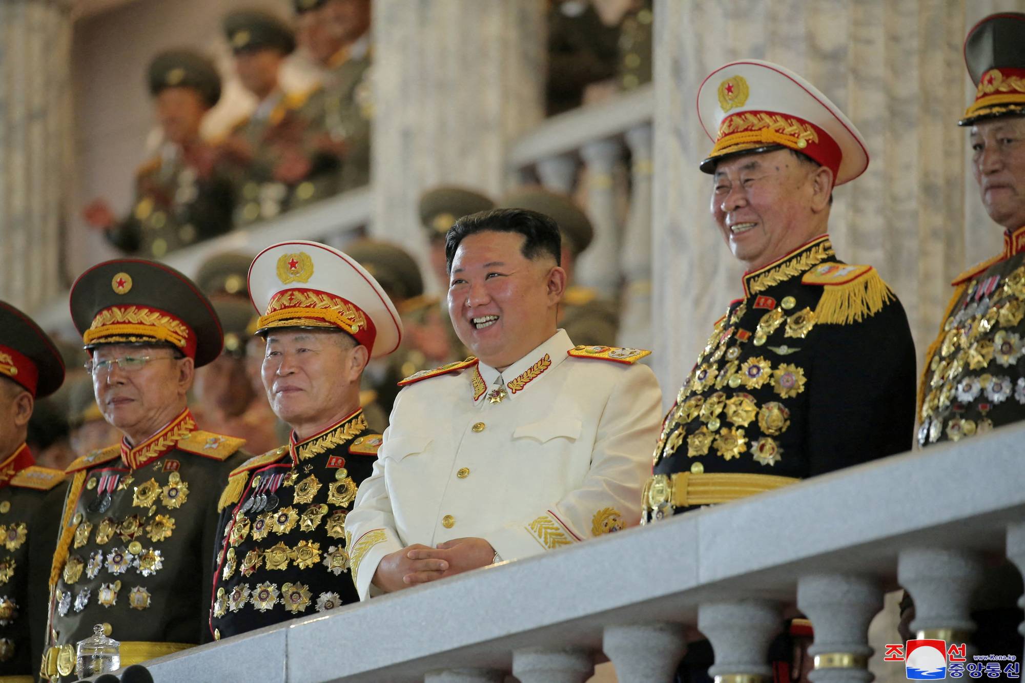 North Korean leader Kim Jong Un watches a nighttime military parade to mark the 90th anniversary of the founding of the Korean People's Revolutionary Army, in Pyongyang, in this undated photo released April 26. | KCNA / via REUTERS 