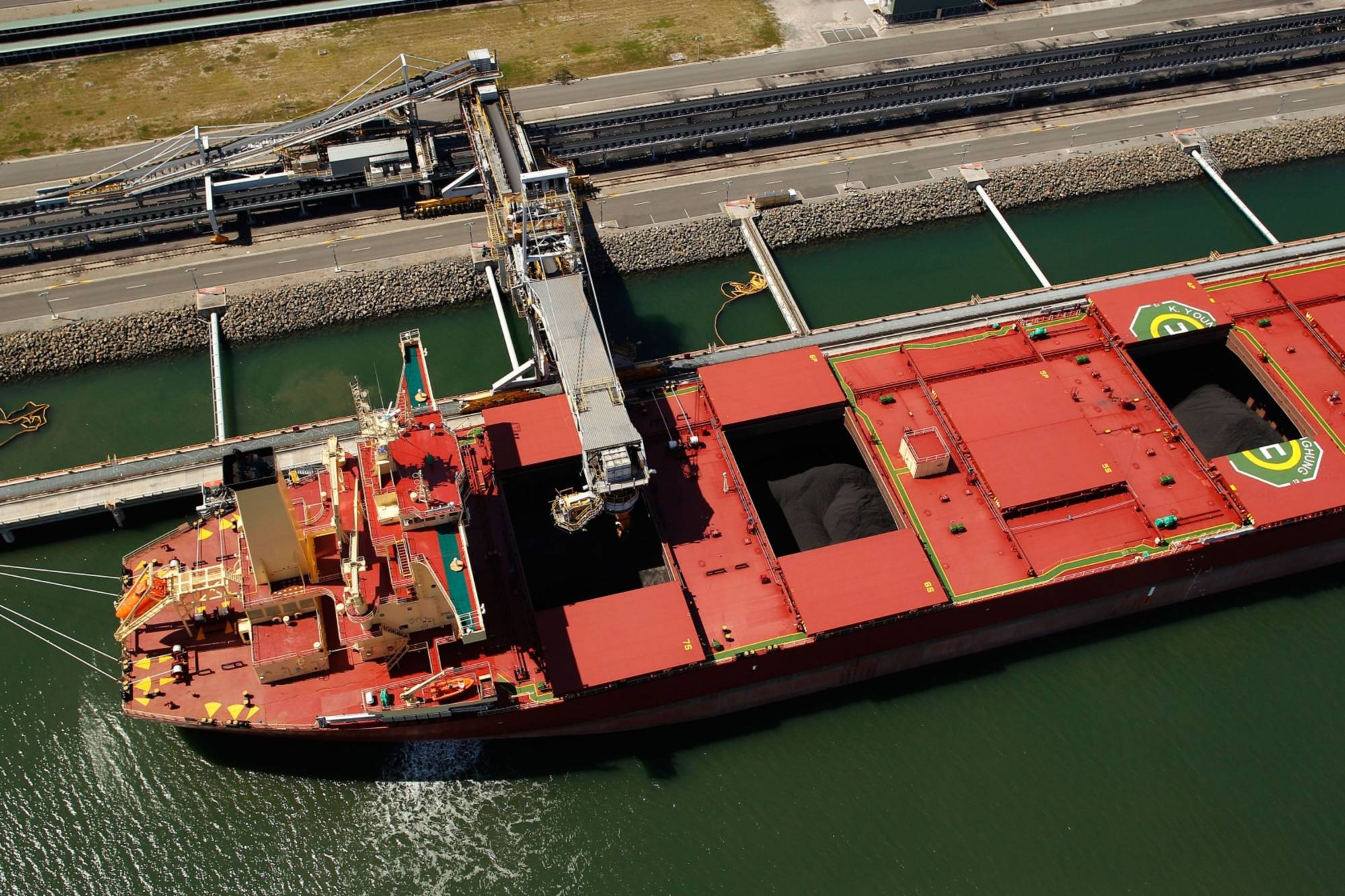 A bulk carrier is loaded with coal at the Newcastle Coal Terminal in Newcastle, Australia, in 2015. | Bloomberg