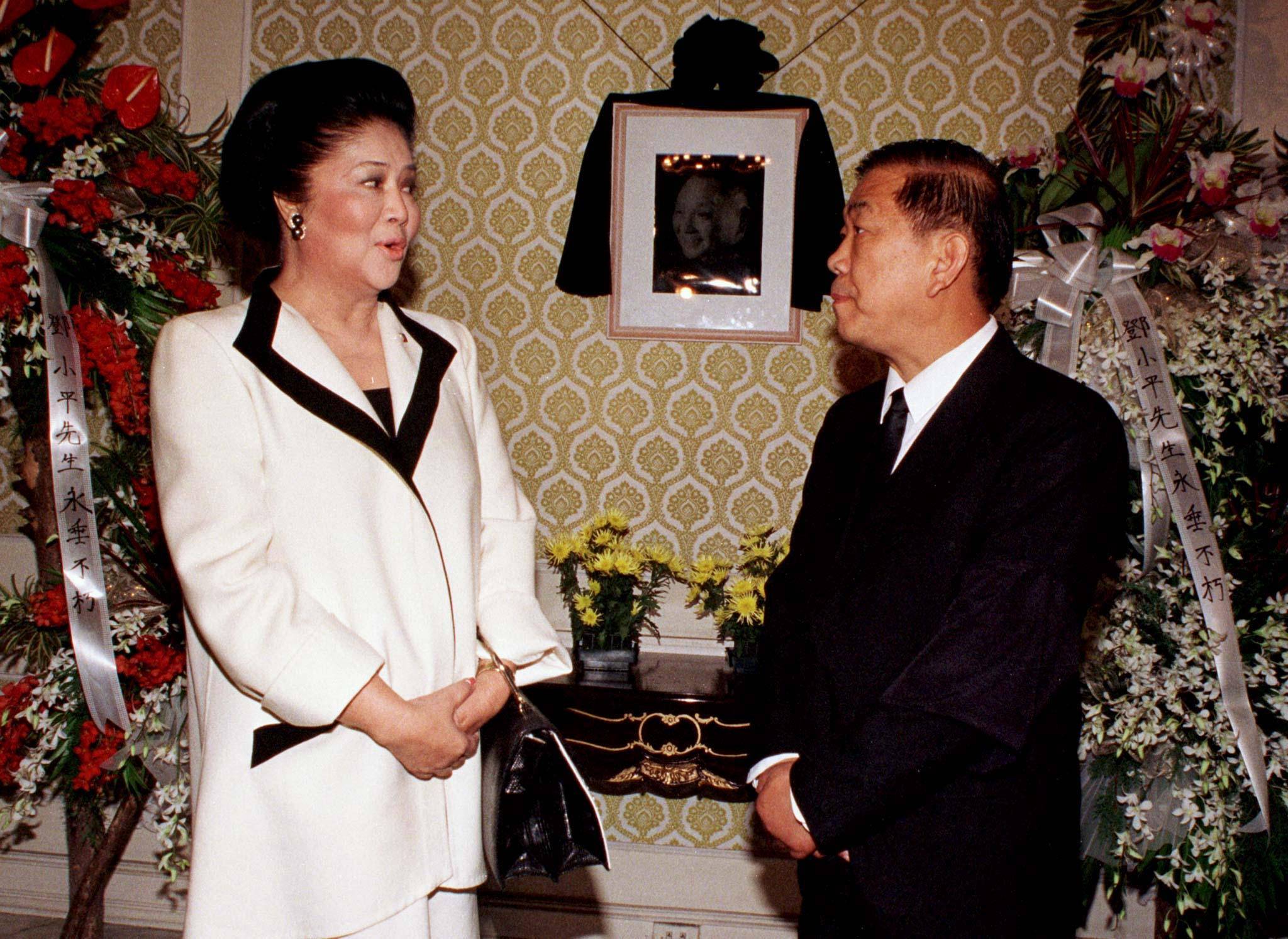 Former Philippine First Lady Imelda Marcos speaks to then-Chinese Ambassador Guan Deng Ming at the Chinese Embassy in Manila in 1997. | Reuters 