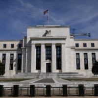 The Federal Reserve Board building in Washington. Several current and former Fed officials have suggested in recent days that, in hindsight, the central bank should have reacted more quickly and forcefully last fall. | REUTERS