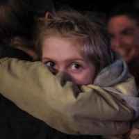 Ukrainian refugee Alisa, 4, from the Azovstal steel plant in Mariupol, whose mother was detained by Russian servicemen during the evacuation, arrives at a registration and humanitarian aid center for internally displaced people, amid Russia\'s ongoing invasion of Ukraine, in Zaporizhzhia, Ukraine, on May 8. | REUTERS
