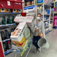 Maria Belkina, co-founder of Volunteers Tbilisi, pushes a shopping trolley with goods she bought to provide to Ukrainian refugees who have arrived in Georgia from the conflict zone, in Tbilisi, Georgia, on April 19. | MARIA BELKINA / VIA REUTERS