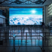 An area for passengers heading to quarantine in the arrival hall at Hong Kong International Airport. As the rest of the world moves past COVID-19 restrictions to living with the virus, Hong Kong’s approach of closing businesses, restricting everyday activities and keeping travelers out looks increasingly outdated and punitive. | BLOOMBERG