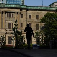 A Bank of Japan policymaker has said it is inappropriate to change monetary policy for the purpose of controlling exchange rates. | BLOOMBERG