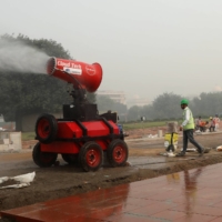 A worker operates an anti-smog gun near a redevelopment project in New Delhi in November.   | REUTERS