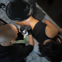 Kim Do-yoon, a tattoo artist who founded a 650-member tattoo labor union that advocates for the rights of artists, at his studio in Seoul on May 3. Tattoo artists, long treated as criminals for their work, say that it is time to end the stigma against their business, which has thrived underground.  | CHANG W. LEE/THE NEW YORK TIMES