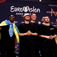Members of Ukraine\'s Kalush Orchestra pose for photos after winning the 2022 Eurovision Song Contest, in Turin, Italy, on Sunday. | REUTERS