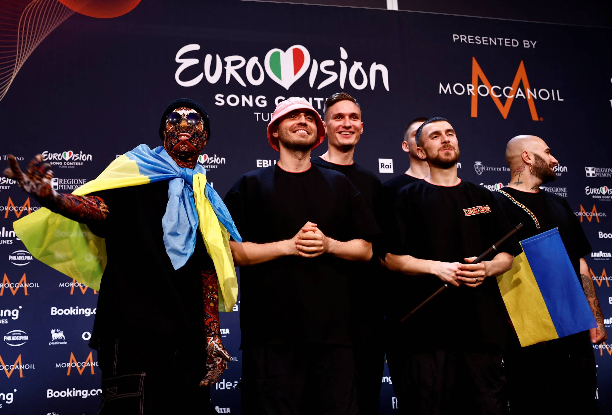 Members of Ukraine's Kalush Orchestra pose for photos after winning the 2022 Eurovision Song Contest, in Turin, Italy, on Sunday. | REUTERS