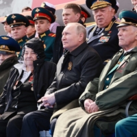 Russian President Vladimir Putin attends the Victory Day military parade in Red Square on May 9.  | SPUTNIK / VIA AFP-JIJI