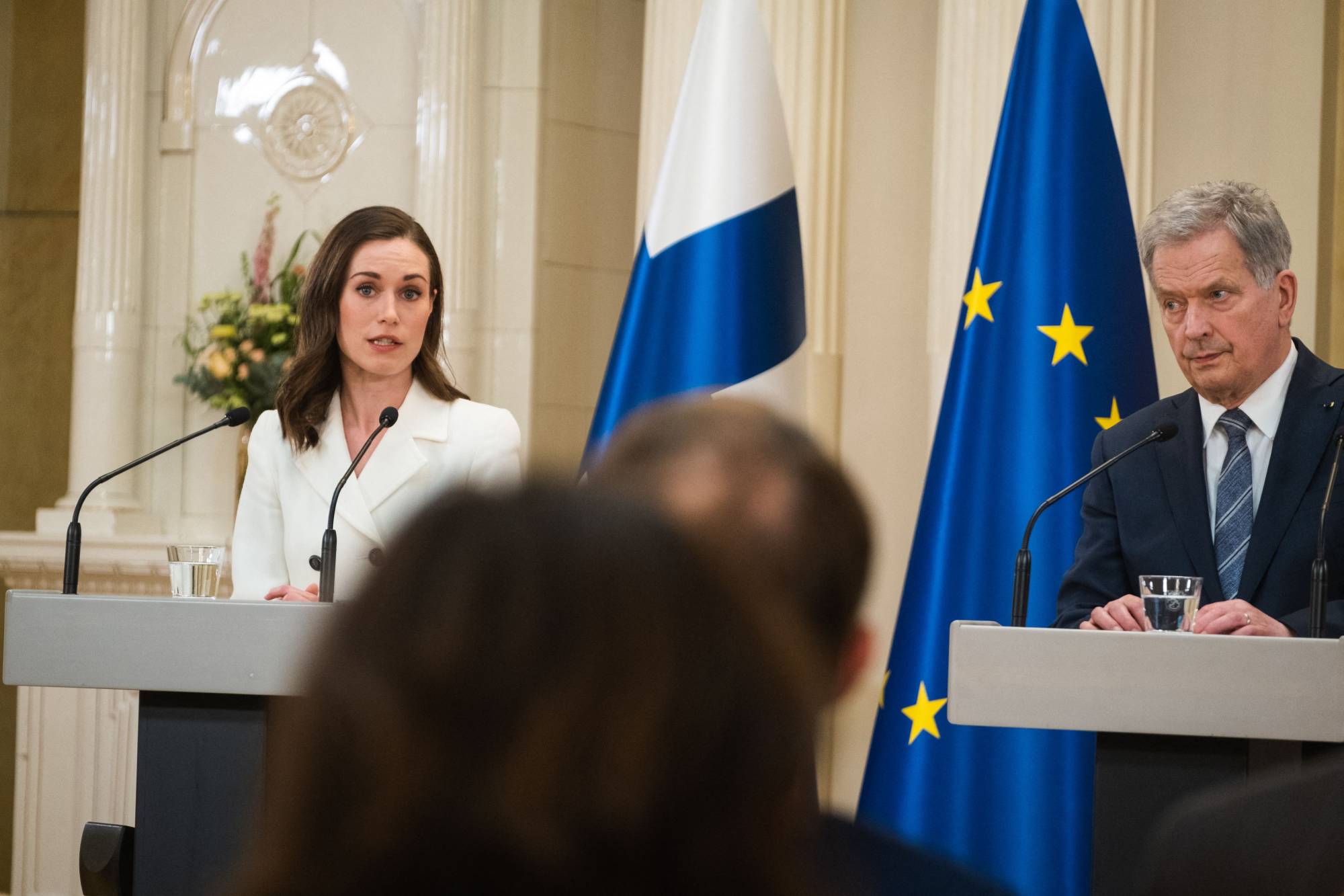 Finnish Prime Minister Sanna Marin (left) and President Sauli Niinistِ take part in a news conference in Helsinki on Sunday. | AFP-Jiji