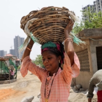 A laborer works at a construction site on a hot day in Noida, India, on Thursday. | REUTERS 