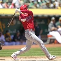 The Angels\' Shohei Ohtani connects on a two-run home run in the first inning against the Athletics in Oakland on Sunday. | KYODO