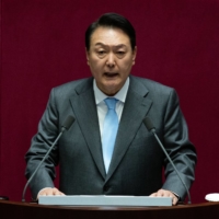 South Korean President Yoon Suk-yeol speaks at the National Assembly in Seoul on Monday.  | POOL / VIA AFP-JIJI