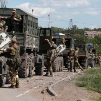 A convoy of pro-Russian troops in Mariupol on Monday | REUTERS 