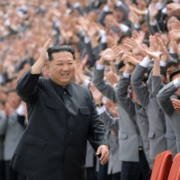 North Korean leader Kim Jong Un greets supporters in Pyongyang on May 1. | KCNA / KNS / VIA AFP-JIJI