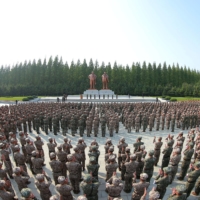 In this photo released Tuesday, military personnel from the Korean People\'s Army medical corps attend the launch of a campaign in Pyongyang to improve the supply of medicine amid an outbreak of COVID-19. | KCNA / VIA REUTERS 