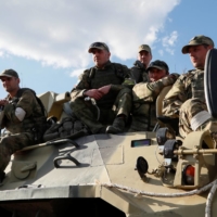 Pro-Russian troops in Mariupol, Ukraine, on Monday. Ukrainian troops held out against massive bombardments for 82 days in Mariupol before ending their resistance this week. | REUTERS 