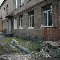An unexploded ordnance at the backdoor of a kindergarten in Lysychansk, eastern Ukraine, on Saturday. The influx of Western heavy guns could give Ukraine an edge in a war that has revolved around artillery duels. | AFP-JIJI