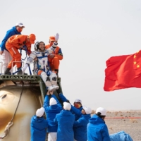 Chinese astronaut Zhai Zhigang is carried out of a return capsule after three astronauts returned to earth following the Shenzhou-13 manned space mission to complete construction of a space station, at the Dongfeng landing site in Inner Mongolia Autonomous Region, China, on April 16. | CHINA DAILY / VIA REUTERS

