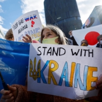 Demonstrators protest the invasion of Ukraine near the Russian Embassy in Tokyo in February.   | REUTERS