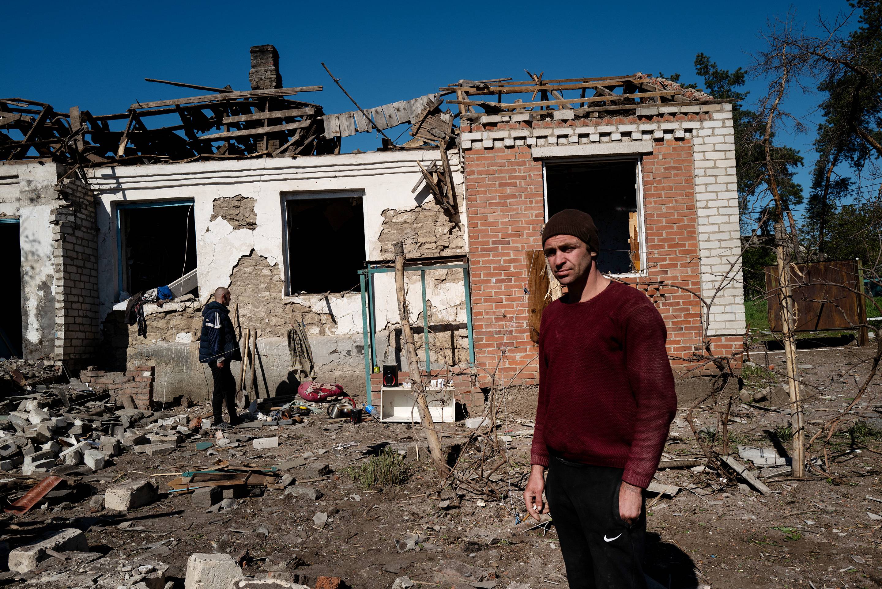 A man surveys the ruins of his home, destroyed in a Russian strike on the small village of Malotaranivka, near Kramatorsk, Ukraine on May 7. | LYNSEY ADDARIO / THE NEW YORK TIMES