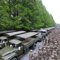 Officers in North Korean military medical units preparing medicine to help resolve the spread of COVID-19, in Pyongyang, on Monday. | KCNA / VIA KNS / VIA AFP-JIJI