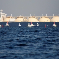 A liquefied natural gas tanker is tugged towards a thermal power station in Futtsu, Chiba Prefecture. | REUTERS
