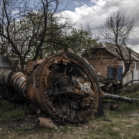 A destroyed Russian tank in Malaya Rohan, a village outside Kharkiv, Ukraine, on Tuesday. Analysts say that as Ukrainian units reach near the Russian border north of Kharkiv, Moscow does not have enough units to accomplish the goals it had a few weeks ago | FINBARR O\'REILLY / THE NEW YORK TIMES