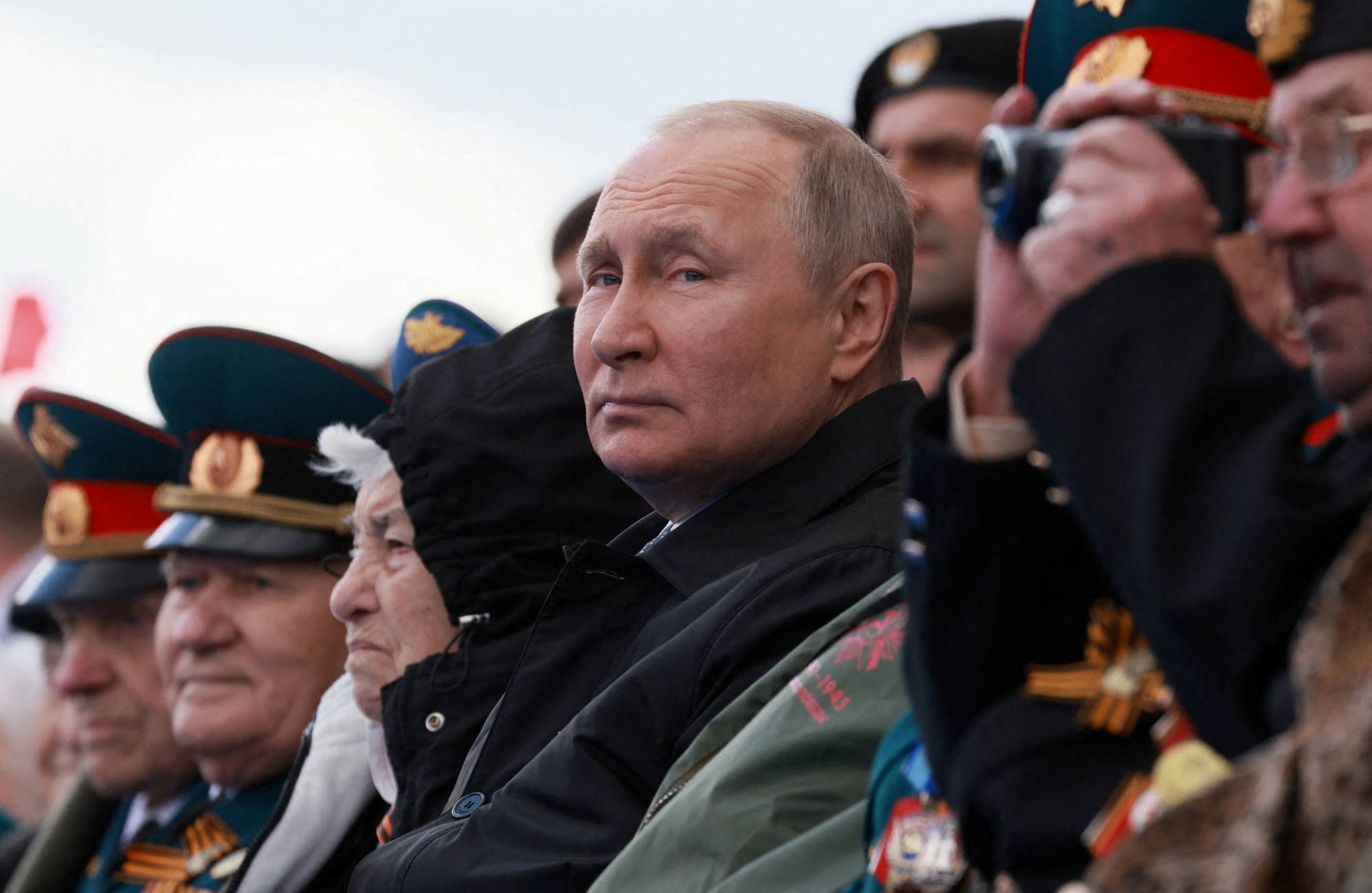 Russian President Vladimir Putin watches a military parade in Moscow on May 9. Washington believes that Putin’s strategic goals have probably not changed, and his decision in late March to refocus forces on Donbas is only a temporary shift to regain initiative. | Sputnik / Pool / via REUTERS
