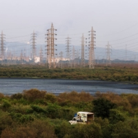 Electricity pylons in Mumbai. Analysts and experts have cautioned that grids may remain under pressure for years, with midday peak demand adding to persistent high use during the night when solar power supplies drop off. | REUTERS