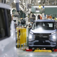 A Mitsubishi Motors eK X electric vehicle in the inspection area of the production line at the company\'s Mizushima plant in Kurashiki, Okayama Prefecture, on Thursday | BLOOMBERG