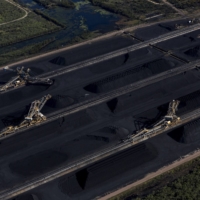 Coal awaiting export at the Abbot Point coal terminal in Queensland, Australia. Voters rejected the deny-and-delay approach that has made Australia a global laggard on emission cuts — but how far the new government will go remains to be seen. | DAVID MAURICE SMITH / THE NEW YORK TIMES