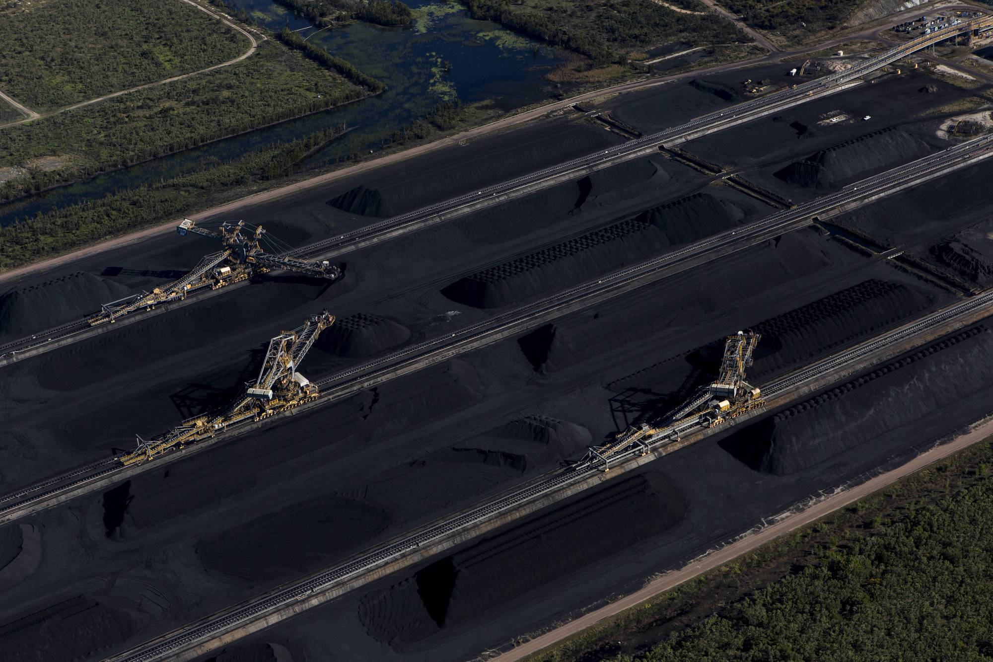 Coal awaiting export at the Abbot Point coal terminal in Queensland, Australia. Voters rejected the deny-and-delay approach that has made Australia a global laggard on emission cuts — but how far the new government will go remains to be seen. | David Maurice Smith / The New York Times
