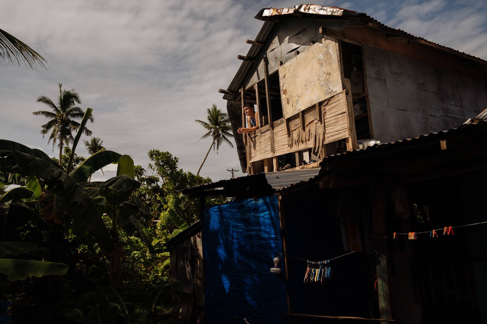Resty Zilmar, the youngest son of Marlen Zilmar, who moved her family to rural Leyte, Philippines, from Manila during the pandemic. | Hannah Reyes Morales / The New York Times