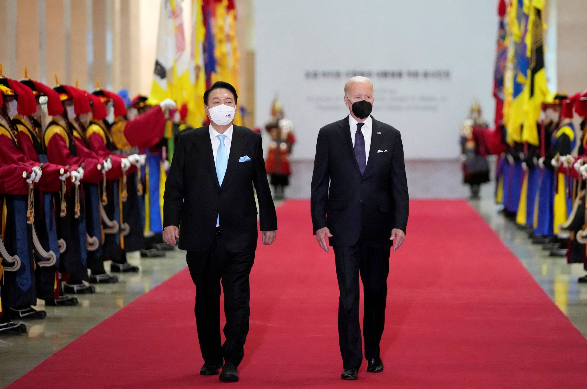 U.S. President Joe Biden and South Korean President Yoon Suk-yeol arrive for a state dinner at the National Museum of Korea, in Seoul, on Saturday. | POOL / VIA REUTERS