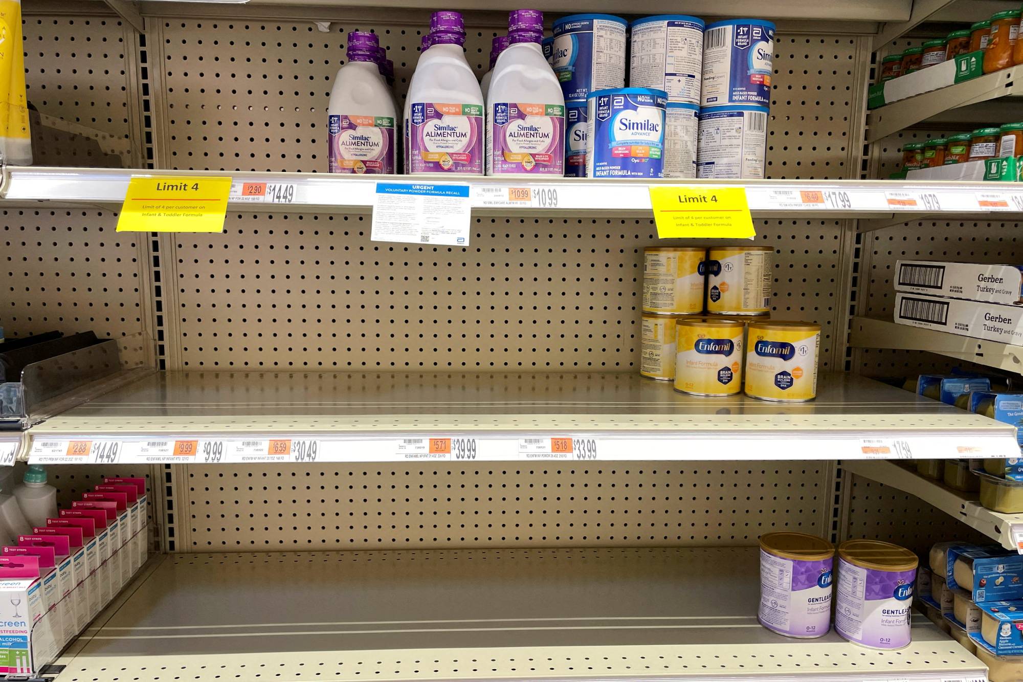 Partially empty shelves for baby and toddler formula at a grocery store in Medford, Massachusetts, on May 17 | REUTERS