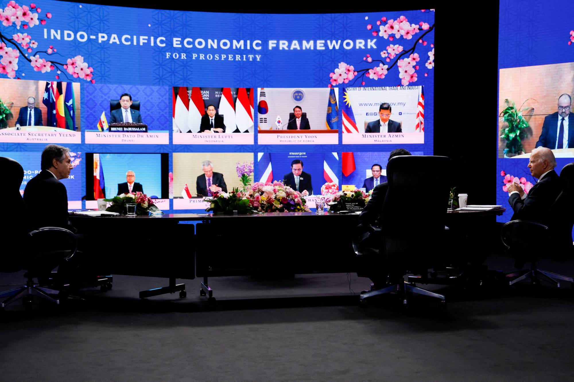 U.S. President Joe Biden, U.S. Secretary of State Antony Blinken and Prime Minister Fumio Kishida listen to other Indo-Pacific Economic Framework for Prosperity member leaders at its virtual launch event at Izumi Garden Gallery in Tokyo on Monday. | REUTERS