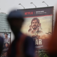 A billboard for the Netflix film \"Thar\" on a street in Mumbai on May 19. Netflix is hoping to tap into the vast India market to find a new subscriber base.  | REUTERS