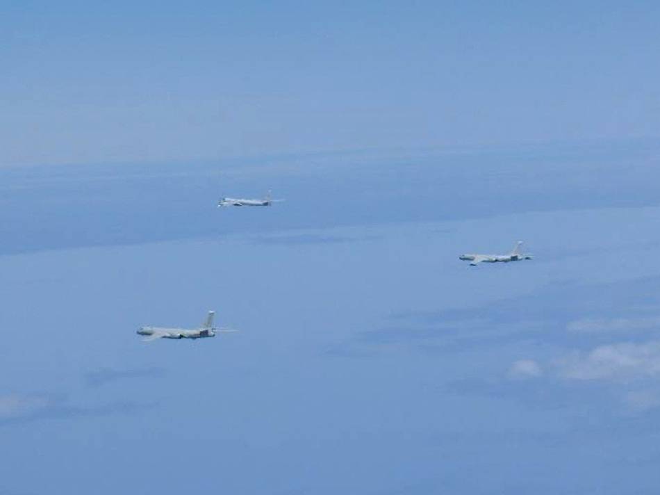 A Russian TU-95 bomber and Chinese H-6 bombers fly over the East China Sea on Tuesday.   | JOINT STAFF OFFICE OF THE DEFENSE MINISTRY OF JAPAN / VIA REUTERS 