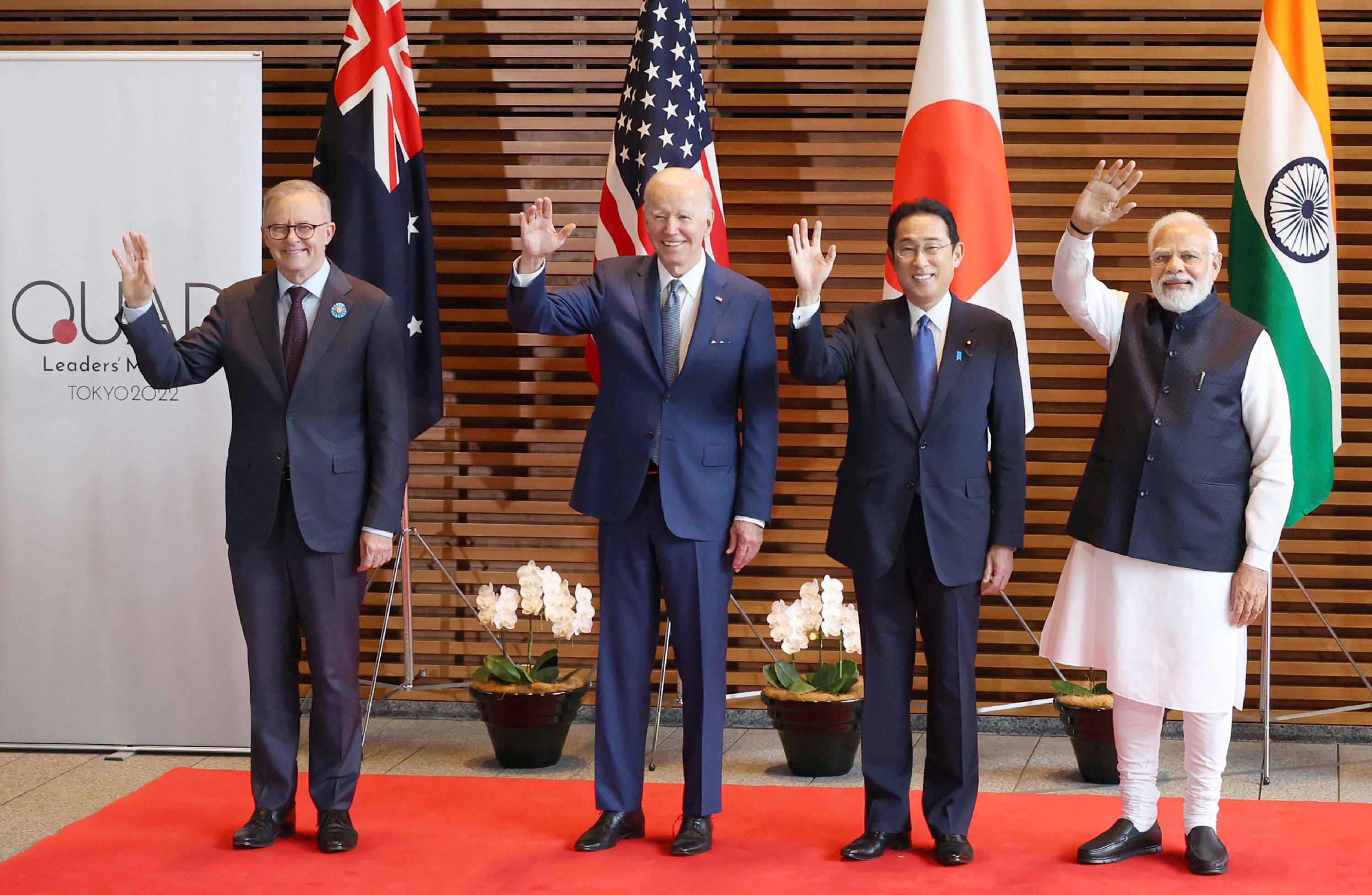 (From left) Australian Prime Minister Anthony Albanese, U.S. President Joe Biden, Prime Minister Fumio Kishida and Indian Prime Minister Narendra Modi wave to the media prior to 'the Quad' meeting at Kishida's office in Tokyo on Tuesday. | AFP-JIJI