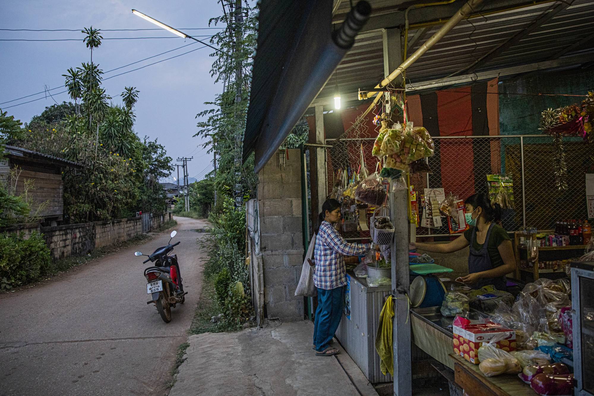 A roadside shop in the village of Baan Mae Kua, Thailand, not far from where a team is searching for evidence of an American WWII pilot who crashed in 1944 during a reconnaissance mission | Lauren DeCicca / The New York Times
