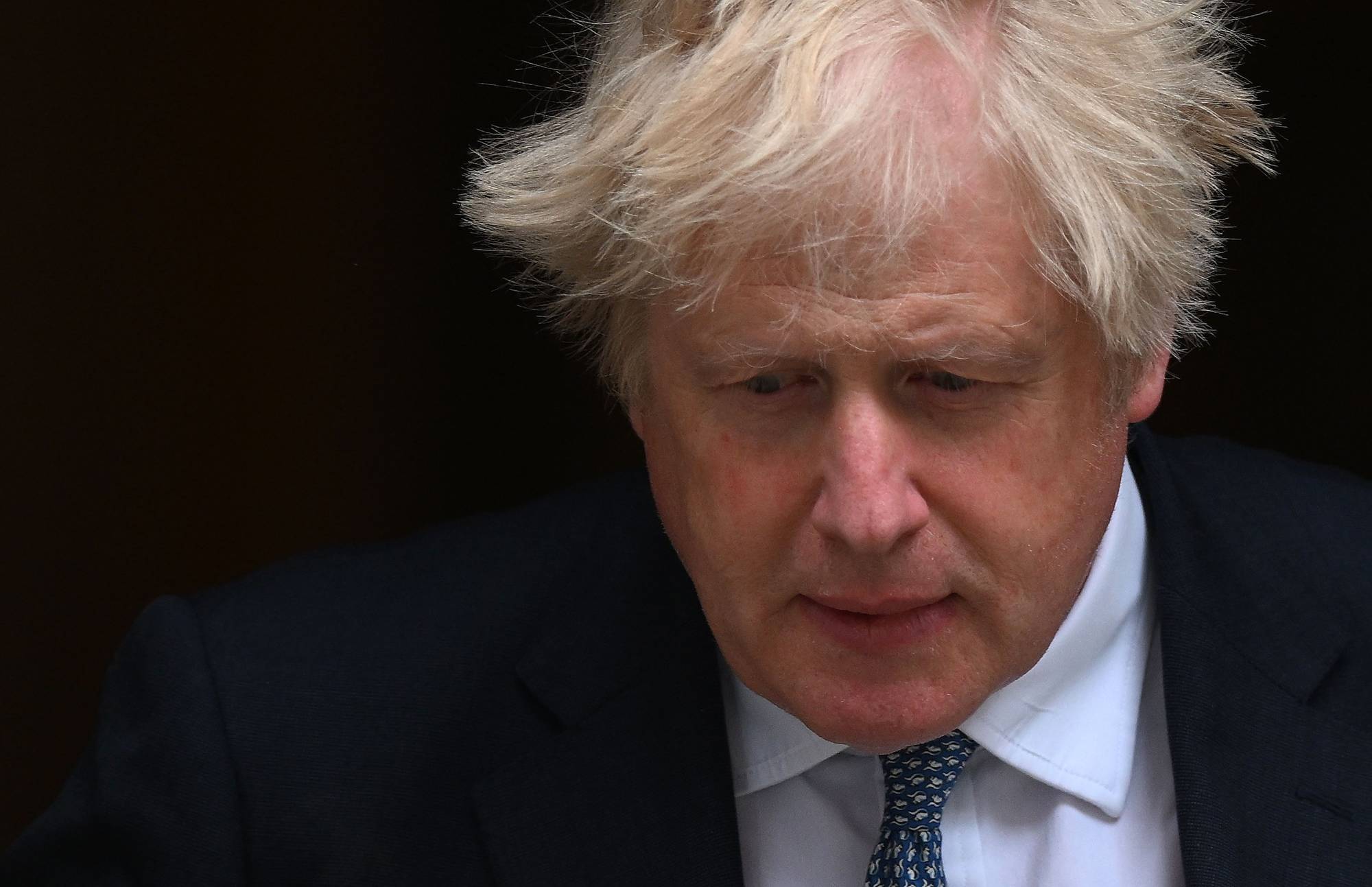 British Prime Minister Boris Johnson leaves 10 Downing Street in London on Wednesday to attend a weekly session of Prime Minister's Questions. | AFP-JIJI