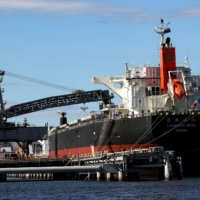 A bulk carrier docked at the Newcastle Coal Terminal. Australia\'s energy consumption is dominated by fossil fuels, with coal providing about 40%, oil 34% and gas 22%, according to government data. | BLOOMBERG