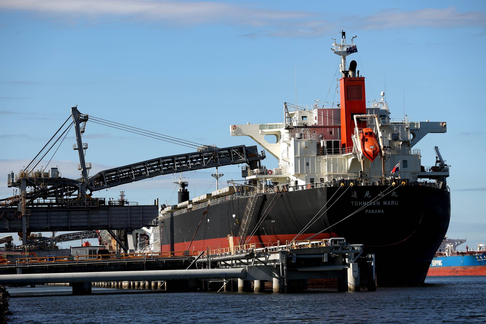 A bulk carrier docked at the Newcastle Coal Terminal. Australia's energy consumption is dominated by fossil fuels, with coal providing about 40%, oil 34% and gas 22%, according to government data. | Bloomberg