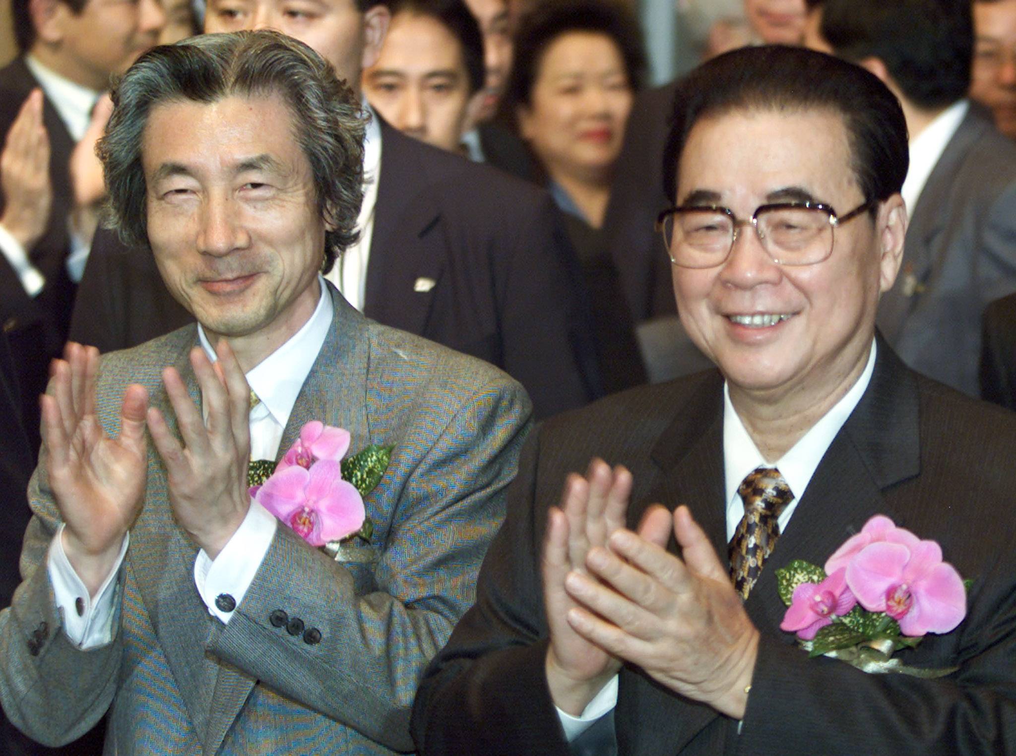 Then-Prime Minister Junichiro Koizumi (left) and China's then-top legislator Li Peng attend an event to kick off the launch of a cultural exchange program marking the 30th anniversary of the normalization of diplomatic ties between the two countries, in Tokyo in April 2002. | Reuters